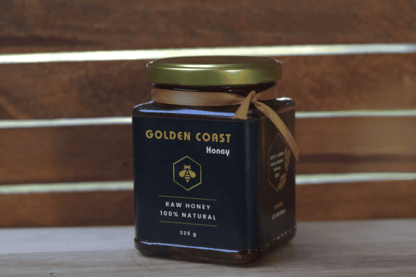 Front view of golden coast honey jar